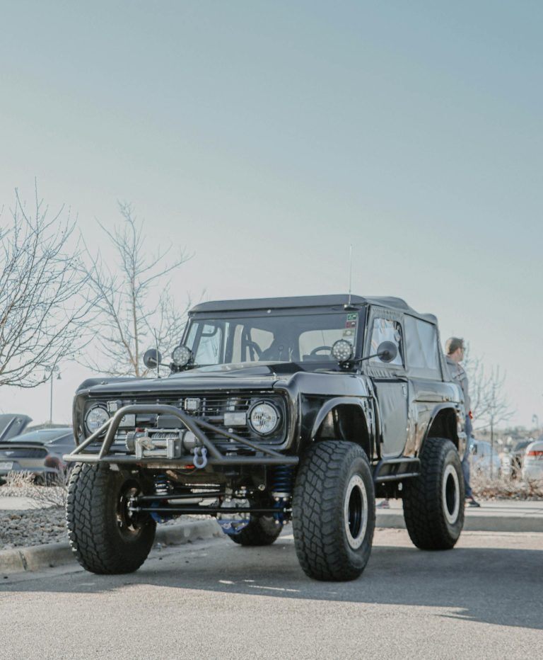 Vintage off-road SUV with large tires parked outdoors in Denver, Colorado.